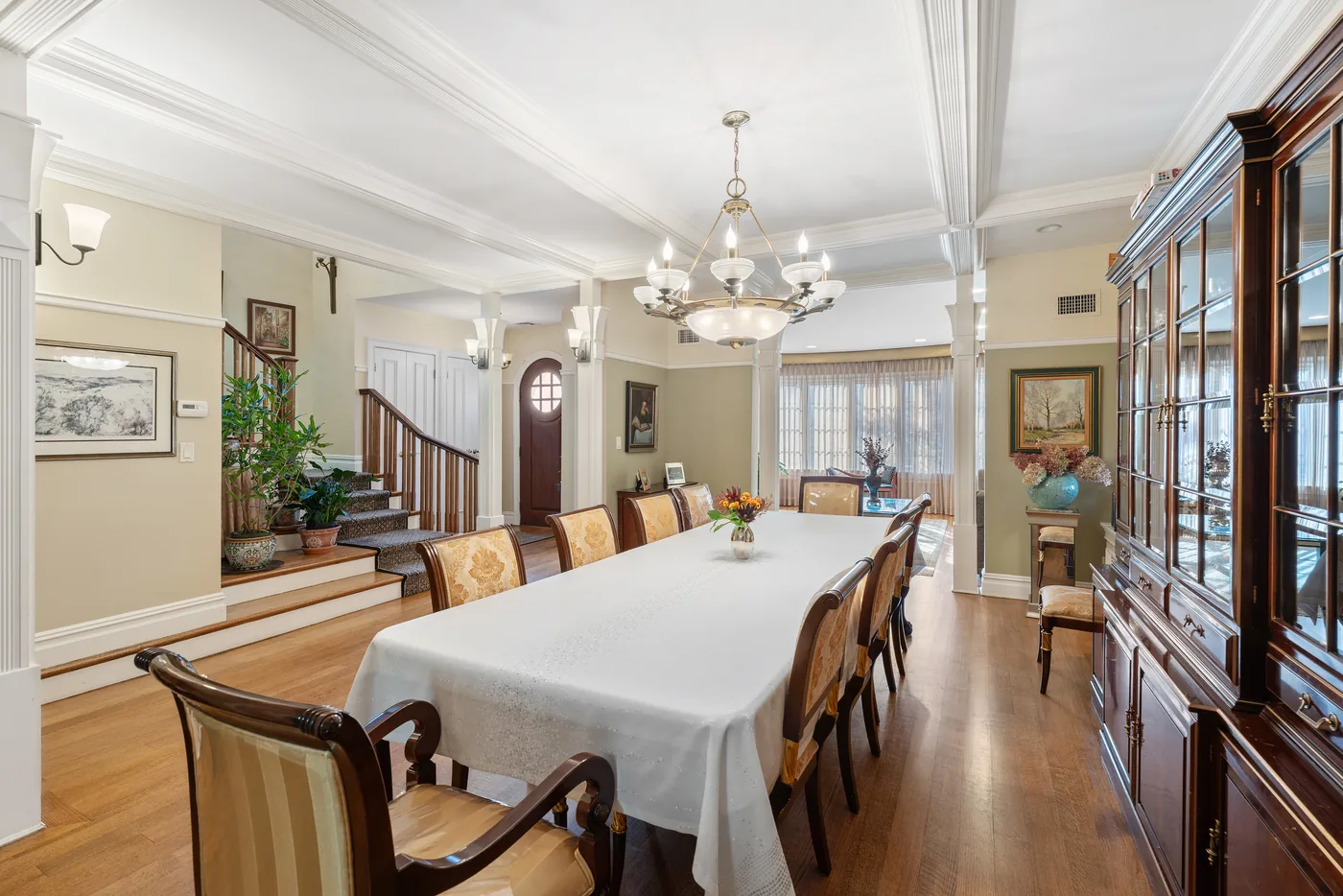 Formal dining room with chandelier photographed for a New York City real estate listing.