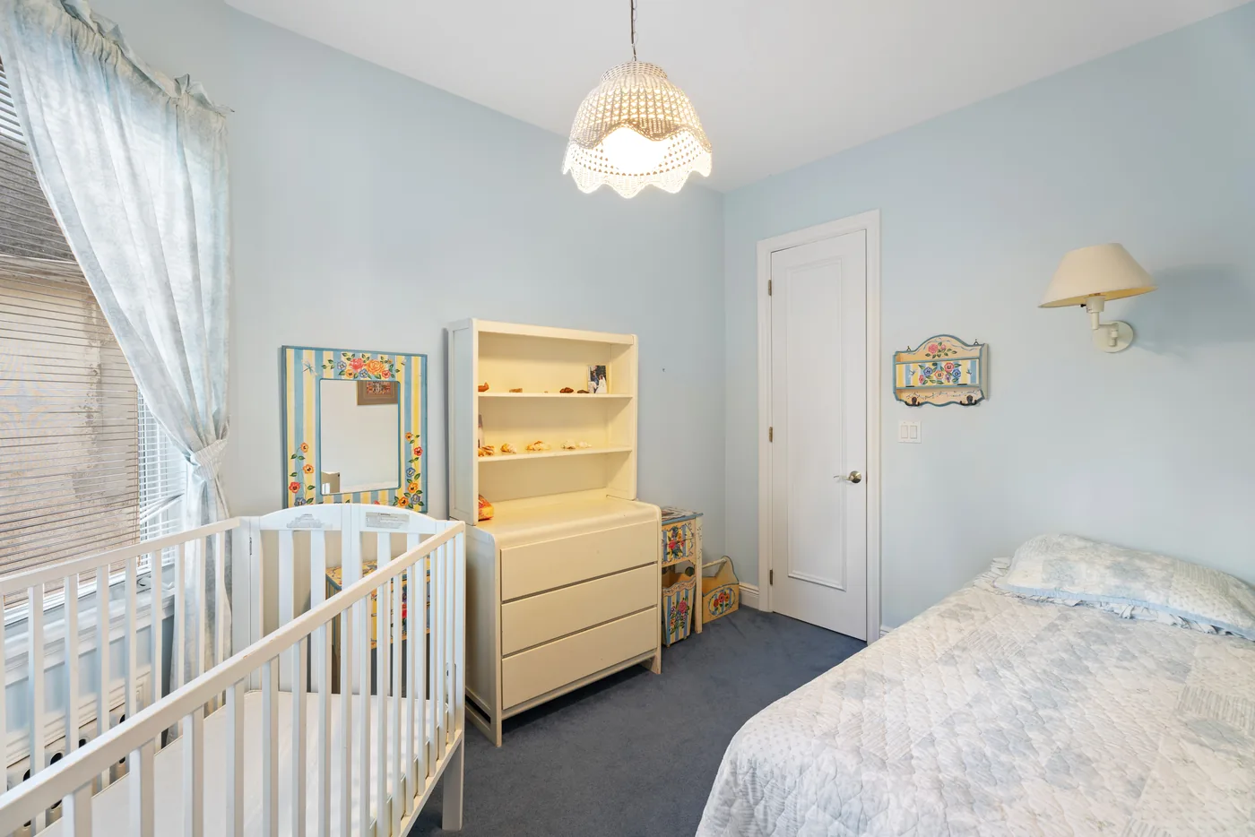 Nursery bedroom with crib photographed for a New York City real estate listing.