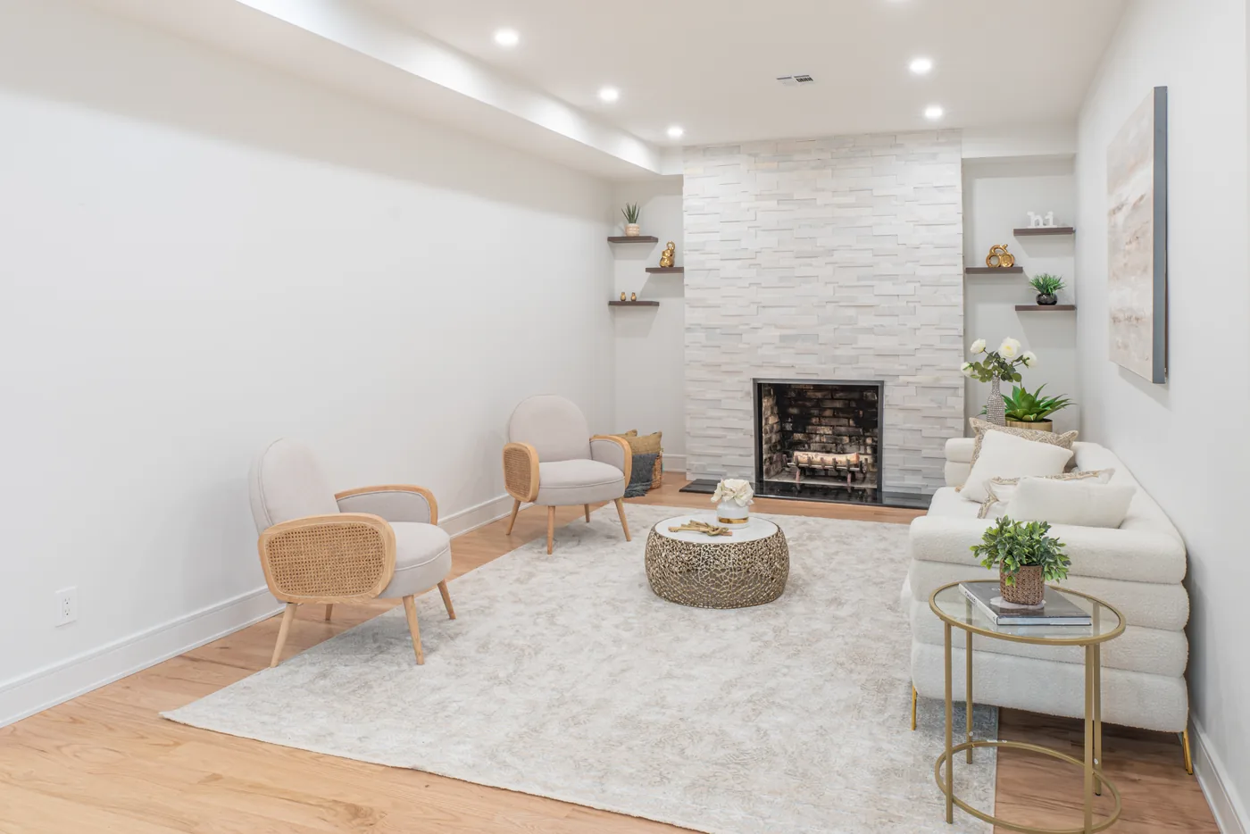 Staged living room with fireplace photographed for a New York City real estate listing.