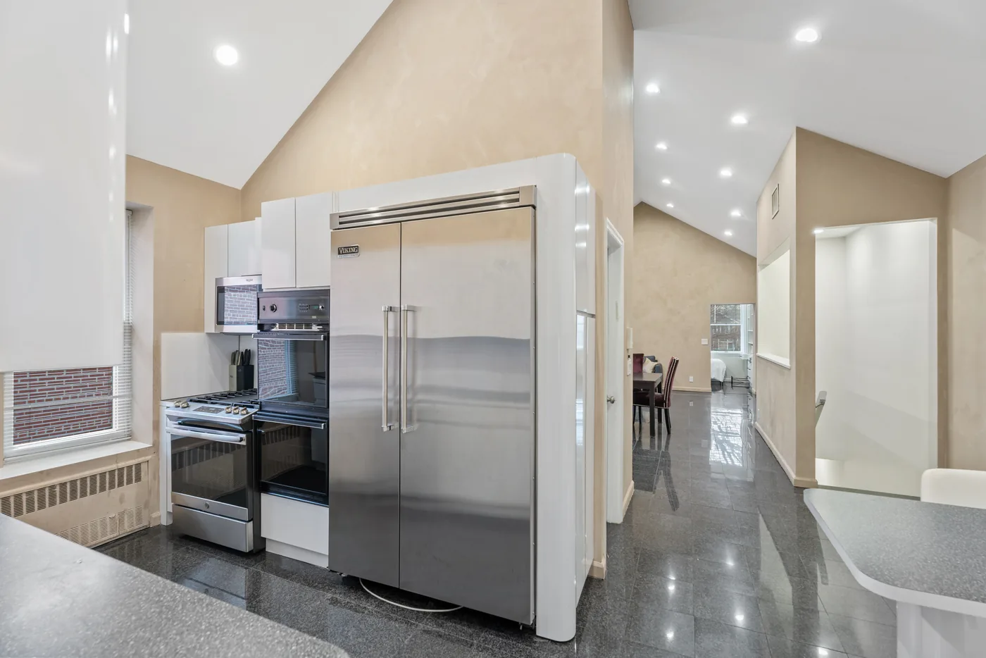 Stainless galley kitchen photographed for a New York City real estate listing.
