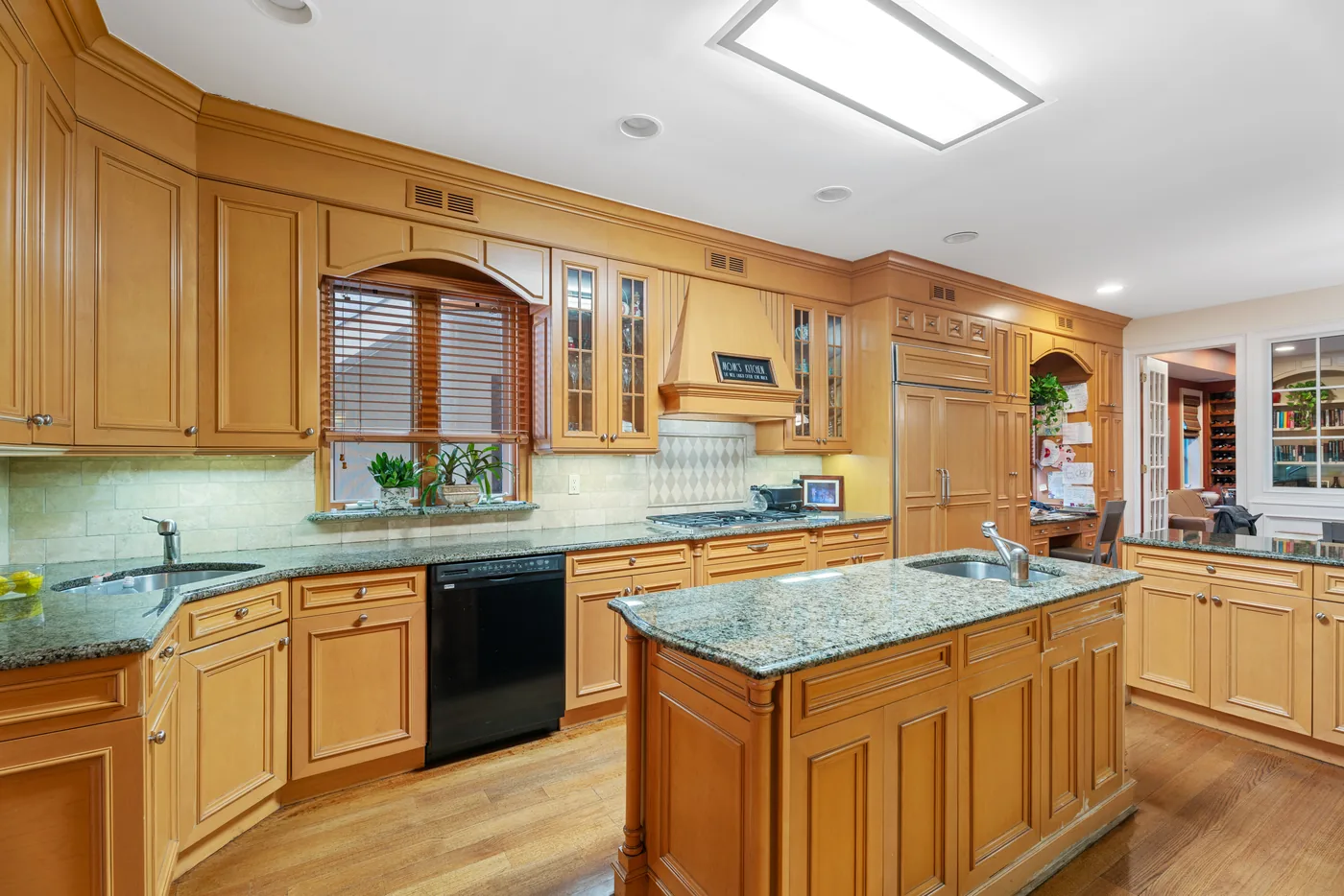 Wood kitchen with center island photographed for a New York City real estate listing.